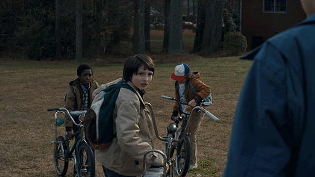 Animated gif - stranger things cast on bikes